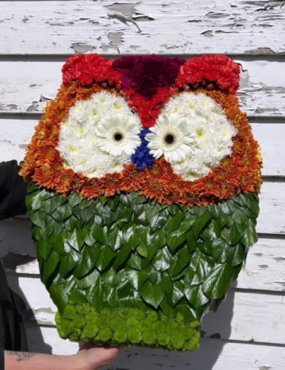 Floral Owl Tribute - A charming handcrafted owl tribute, designed with vibrant blooms to celebrate a loved one with warmth and character.