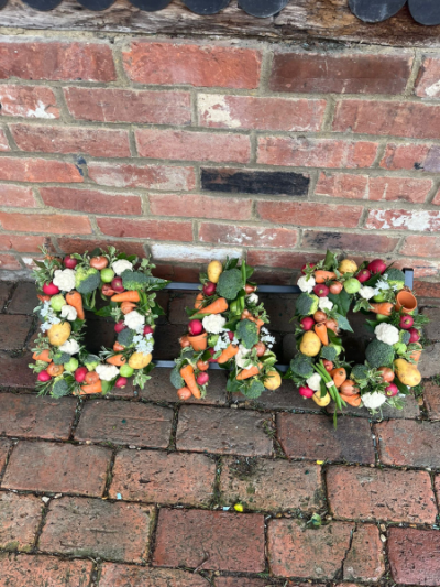 Gardener's Pride - A unique floral tribute beautifully crafted with a colourful selection of fresh vegetables, personalised to reflect a keen gardener's passion.